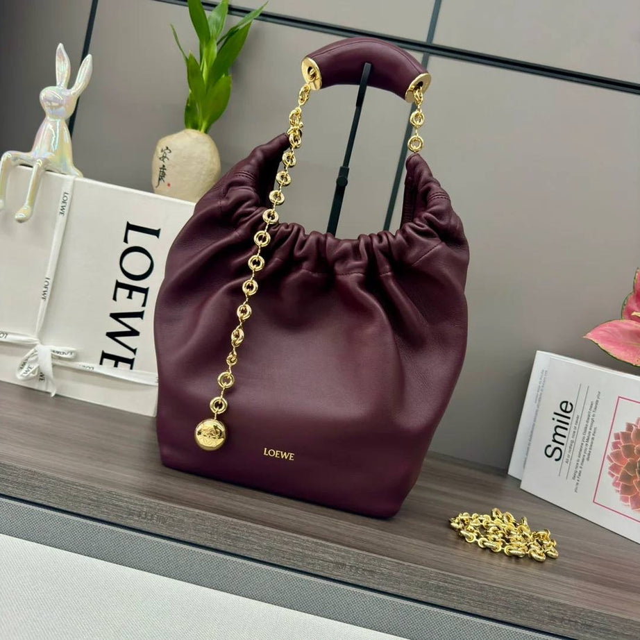 BOLSO SQUEEZE MEDIANO VINO